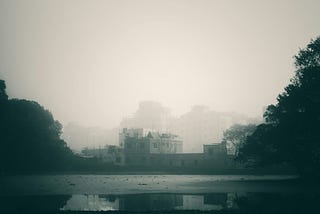 Scene of the crime. Image of misty lake with castle like building.