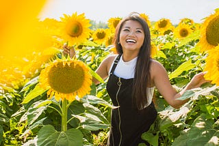 Girl in field of sunflowers