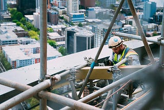 A builder working at a construction site.