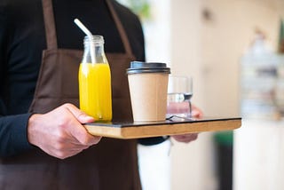 orange juice on a serving tray