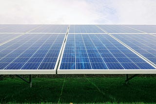 Large older style solar panel array in a field