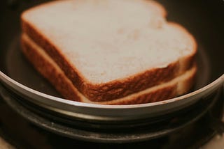 Two slices of white sliced bread in a bowl