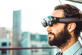 A man wearing augmented reality glasses