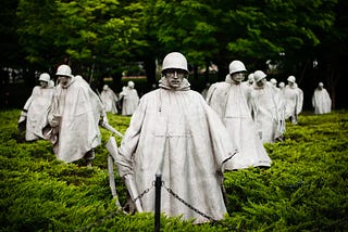 Statues of soldiers with riffles.