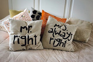 Mr & Mrs Right cushions on a bed