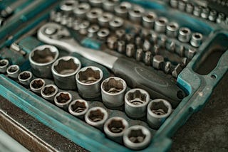 Production features vs fixing nuts, bolts and tools