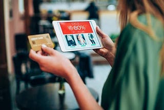 A woman doing online shopping from an app