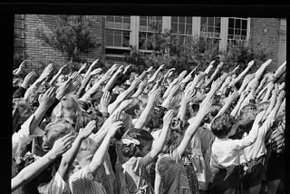 Students using the Bellamy Salute