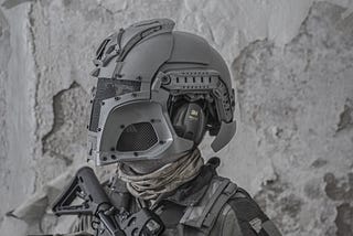 Airsoft player with weapon and helmet