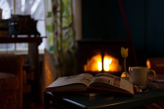 A book and cup of tea in front of the fire can be the perfect beginning for an evening routine.