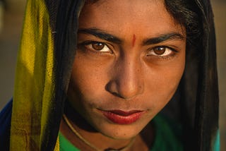 An Indian girl with a bindi on her fore-head and a veil on her head