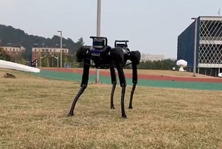 This robot dog learned how to get up after being knocked down