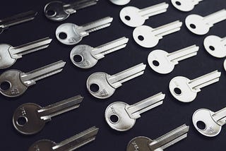 Many blank silver keys sit against a black background in neat rows and columns.
