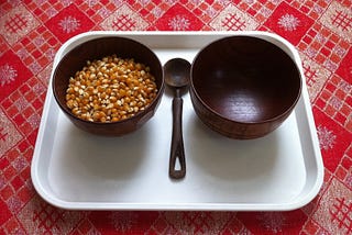 Transferring corn kernels with a spoon