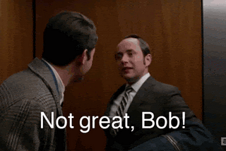 A gif of a white guy in a suit angrily telling another guy “Not great, Bob!”