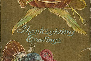 A postcard “Thanksgiving Greetings” with a pumpkin winking at the turkey below. The pumpkin is wearing a straw hat, smoking a corncob pipe, and has a piece of straw hanging out of the other side of his mouth. The turkey has a full, colorful plumage.