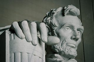 Lincoln Memorial; close-up of Abraham Lincoln’s hands.