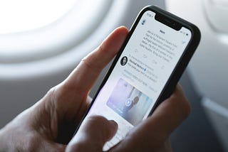 Picture showing a phone being used on a plane.
