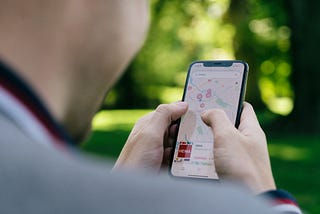 a person looks at a map on his phone screen