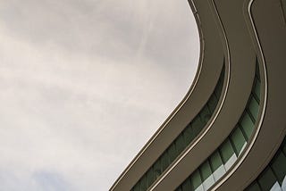 Curved building balconies against a perfectly gloomy sky