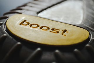 A yellow button with the word boost on it.