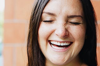 Laughing woman big smile