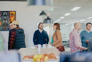 Social gathering with food in the foreground.