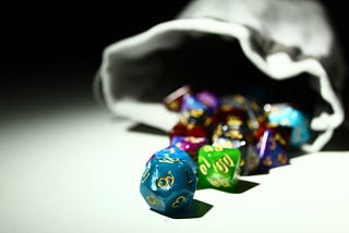 Image showing a bag of dice used in roleplaying games. Shows various sizes of polyhedral dice.