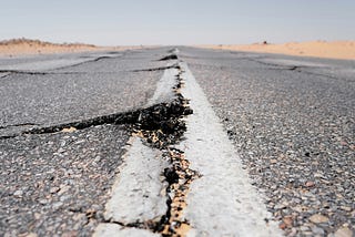 A road cracked from a recent earthquake.