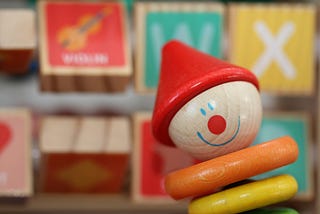 Colorful children’s toys, smile stuck in place