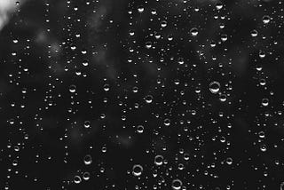 raindrops on a window, monochrome