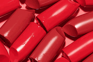 multiple red lipsticks melting together