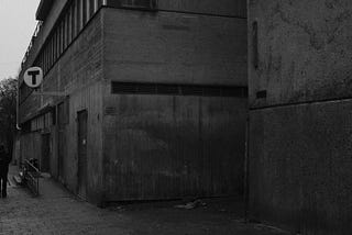 A black and white photo of a building in the archetectural design of brutalism