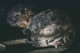 A pair of standard military issue helmets