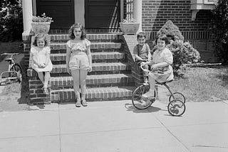 playing outdoors 
(me and two girls and a boy)