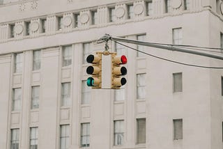 An image of street with focus on signal lights to signify the trade-offs in decision making