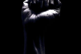 black and white photo of a raised fist