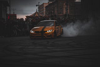 A yellow car drifting.