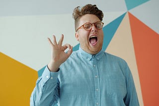 A person making the OK sign with his fingers