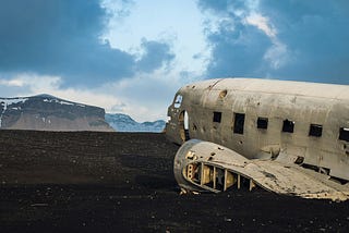 shell of a plane on a scenic vista