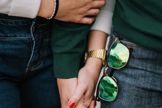 A man and woman holding hands