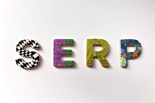 The word SERP spelled out in patterned letters