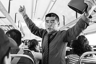 preacher preaching on a bus in Guatemala