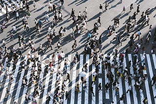 A crowd of people crossing the street in Shibuya