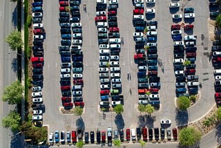A bird’s view of a full street side parking lot