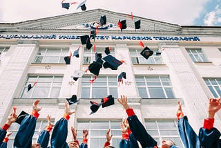 The writer pictures a college graduation ceremony with caps flung in the air.