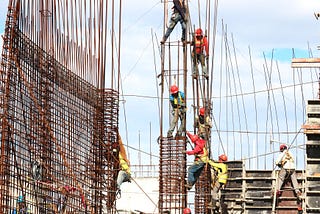 Workers architecting a building