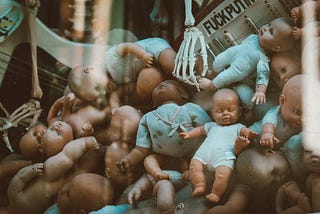 Pile of Dolls Photo — Abortion & Law