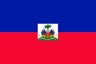 A flag divided by two colors. Blue at the top, red at the bottom. The center is a rectanglualr small image of a palm tree and coat of arms