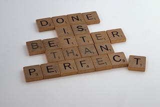 Scrabble tiles compose “Done is better than perfect”